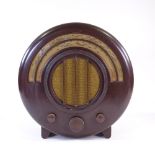 An EKCO model AD65 wood-effect Bakelite radio, 1934, designed by Wells Coates for E K Cole Ltd,