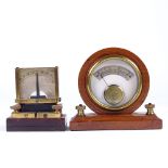 A pair of brass bound desktop galvanometers.