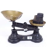 A set of Vintage cast-iron brass pan balance scales, with brass and iron weights