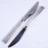 A set of 12 silver plate and steel British Airways Concorde/First Class British Airways knives, by