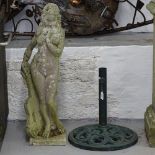 A weathered concrete garden statue, H80cm, and a cast-iron parasol stand