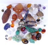Various natural crystal and carved and polished semi precious stones, including tigers eye egg, rock