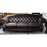 A brown leather button-back upholstered 3-seater sofa, with rollover arms, by Thomas Lloyd,