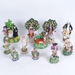 A group of mainly 19th century Staffordshire figures, including a pair of Bocage figures with gold