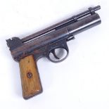 A Webley & Scott Ltd Mark I .177 barrel cocking air pistol, with blued barrel and walnut grips