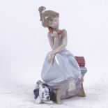 A Lladro porcelain figure of girl on the phone, model no. 5466, height 20cm
