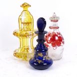 An unusual amber and clear glass decanter and goblet set, and 2 other glass scent bottles, largest