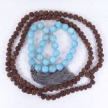 A large Chinese strand of polished blue stone prayer beads, and a strand of nutshell prayer beads (