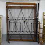 A Victorian iron and brass 4'6" bed, with box sprung base