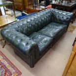 A green studded leather-upholstered Chesterfield settee, with rollover arms, L110cm, H70cm, seat