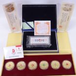 2 souvenirs from the 2008 Beijing Olympics, one containing a bar of silver and the second being