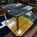 A 1970s modernist brass and smoked glass top coffee table, W48cm, H40cm