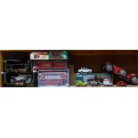 A collection of Burago and Corgi model toy cars (1 shelf)