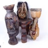 A group of Tribal items, including a stool carved from a single piece of wood, a grotesque mask, a