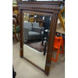 An Antique French carved oak-framed wall mirror, with fluted columns, W102cm, H140cm