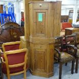 A pair of pine corner bedside cabinets