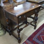 A 1920s oak side table, with single frieze drawers and turned stretchers, W76cm, H73cm, D44cm