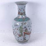 A Chinese porcelain vase with design of children playing in a garden, 6 character mark, height 39cm