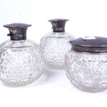 A pair of glass scent bottles, and a matching powder bowl, all having silver and mother-of-pearl