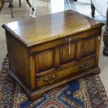 A Titchmarsh & Goodwin Ipswich oak TV stand, with panelled fall-front, on bracket feet, W67cm,