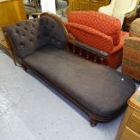 A 19th century carved mahogany-framed chaise longue, with buttoned-back upholstery, on turned