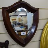 A mahogany-framed shield-shape bevel-edge wall mirror, overall height 39cm