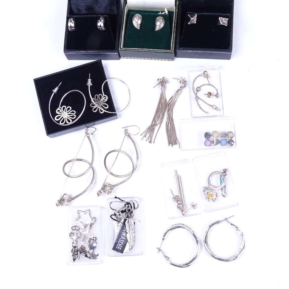 A large quantity of silver earrings, some boxed