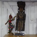 A Tibetan carved hardwood figure of Guanyin, H100cm, and another