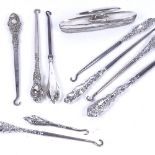 9 various silver-handled button hooks, and a silver-mounted nail buffer