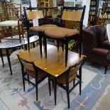 A mid-century teak rectangular dining table, with integrated spare leaf, and label for White &