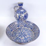A European Faience creamware wine flagon, and a similar large blue and white bowl, stapled, diameter