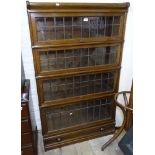A late Victorian mahogany and satinwood-banded cabinet, raised mirrored back with lattice glazed