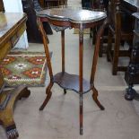 A Continental walnut side table, with shaped top and under-tier, ormolu mounts, on splayed