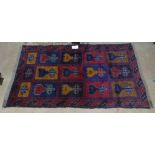 A red ground Beluchi rug, 131cm x 78cm