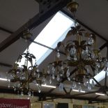 A pair of gilt-metal 3-branch candelabras, with lustre drops, L60cm