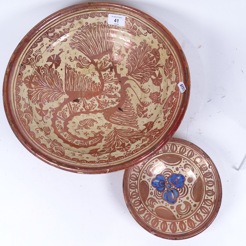 A 17th century Hispano-Moresque Spanish copper lustre faience bowl, phoenix decoration, and a