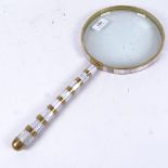 A very large mother-of-pearl and brass-mounted magnifying glass, length 42cm