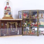 A brass-framed 3-tier display cabinet, containing various miniature collectables, a handmade diorama
