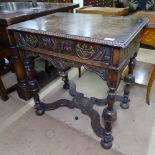 An Antique style oak side table, with carved edge, single relief carved frieze drawer, raised on cup