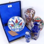 A modern Iznik hand painted pottery plate, diameter 18cm, in fitted case, an Oriental ginger jar