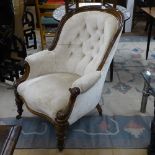 A Victorian button-back and mahogany-framed armchair