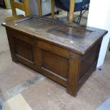 An 18th century joined oak coffer of small size, with panelled front, on stile legs, W92cm, H44cm,