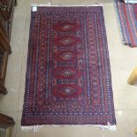 A red ground Bokora rug, 125cm x 80cm