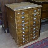 A small Vintage pine bank of 18 short drawers, W53cm, H74cm, D51cm
