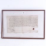 A handwritten document dated 1664, signed with a seal, framed