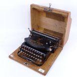 An early German portable typewriter by Klein-Adler, Frankfurt, in original oak case