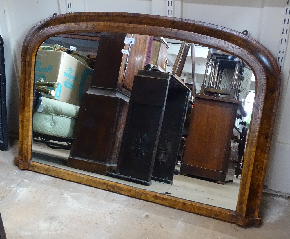 A Victorian walnut and satinwood-strung arch-top over mantel mirror, W106cm, H70cm