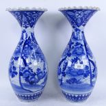 A pair of Chinese porcelain blue and white vases, with floral decoration, 44.5cm (A/F)