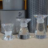 A graduated set of 3 Swarovski Crystal glass candlesticks, largest height 10.5cm, boxed (3)