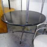 A mid-century circular dining table, with ebonised top, on chrome base, W120cm, H73cm